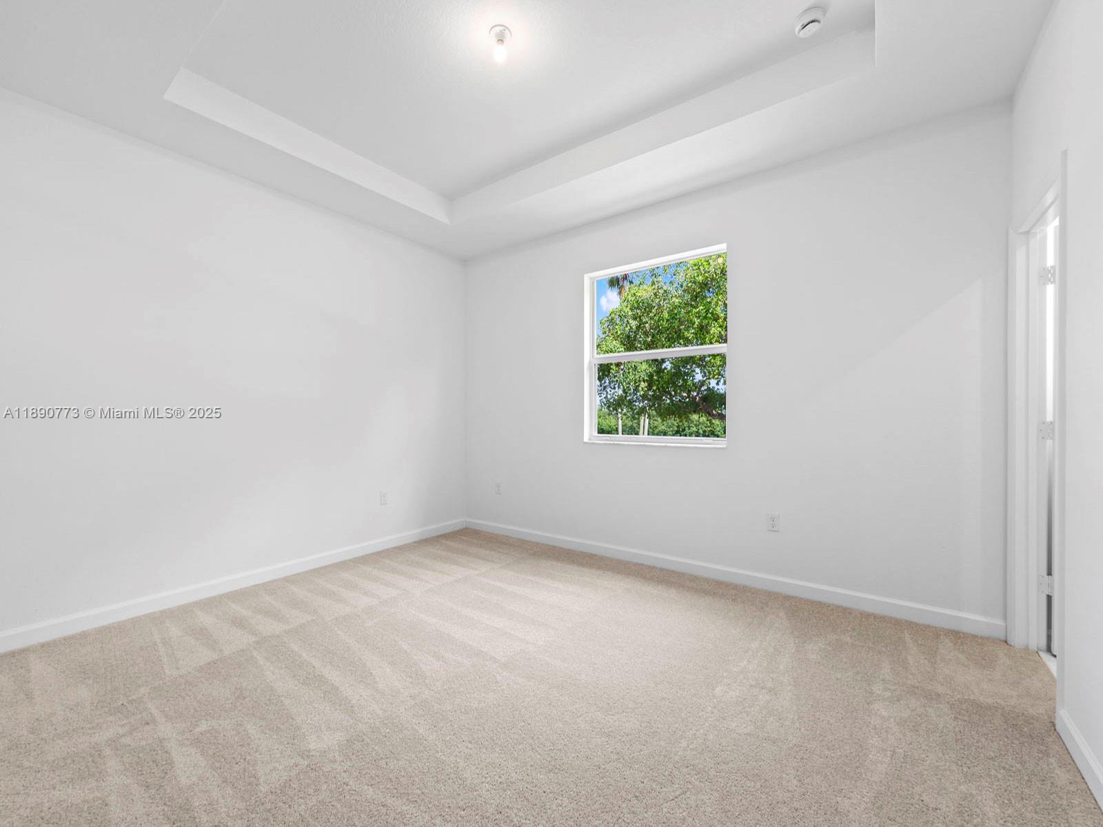1525 Southeast 27th Street Homestead, FL 33035 - Photo 8 of 9 an empty room with a window