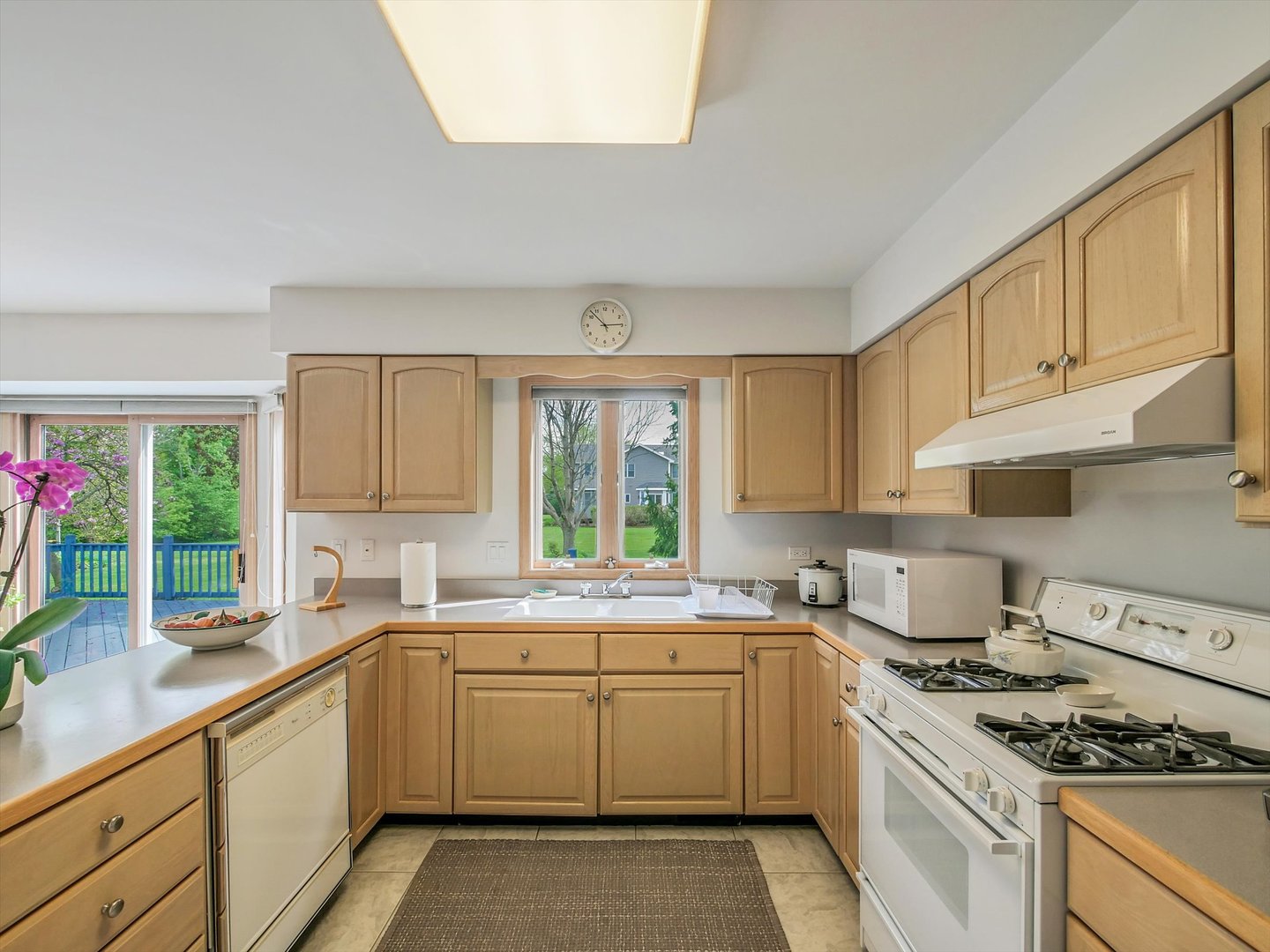 1515 Pine Street Spring Grove, IL 60081 - Photo 20 of 38 a kitchen with a sink stove top oven and cabinets
