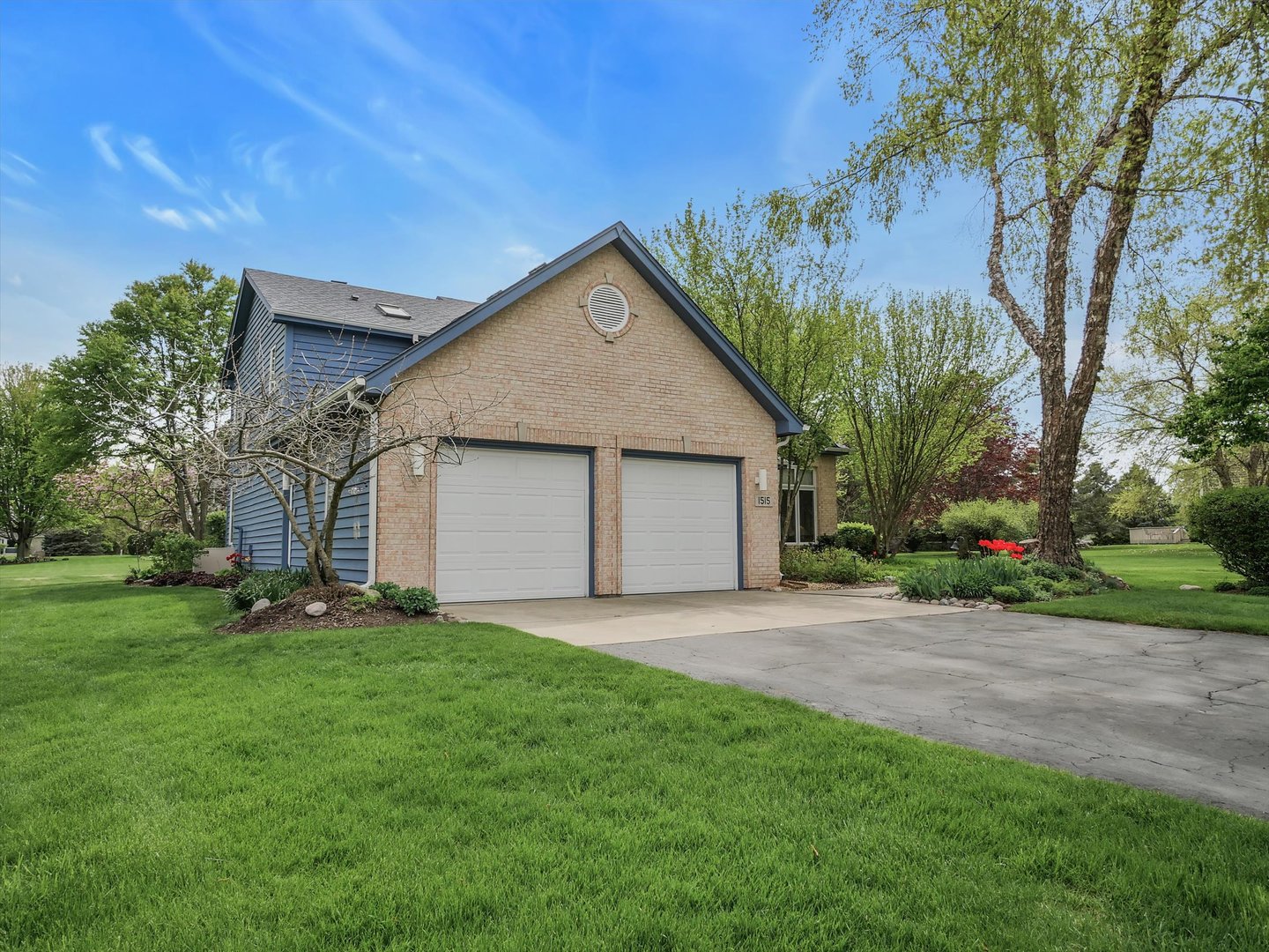 1515 Pine Street Spring Grove, IL 60081 - Photo 2 of 38 a front view of house with a garden and yard