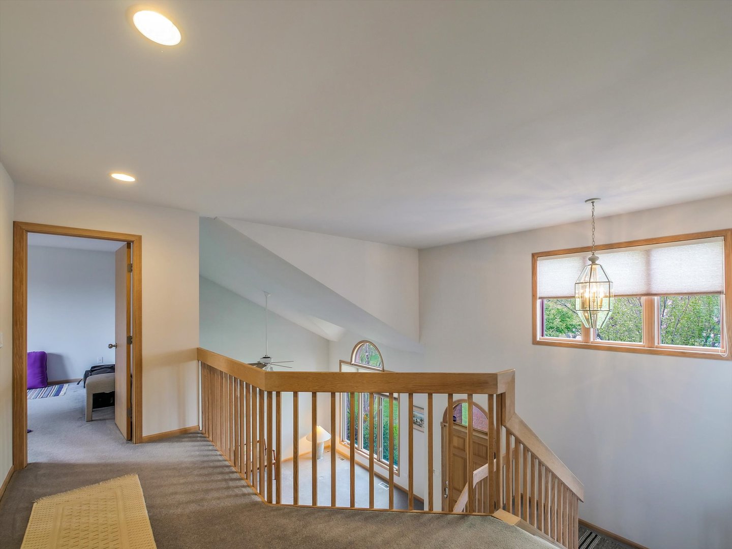 1515 Pine Street Spring Grove, IL 60081 - Photo 28 of 38 a view of hallway with a large window and chandelier