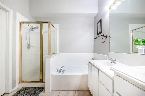 a bathroom with a bathtub and a sink