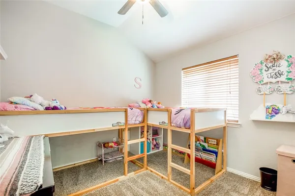 a bed room with a bed and a window