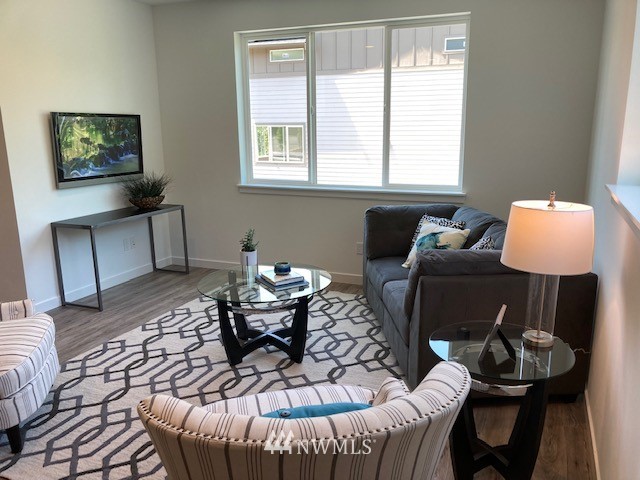 4861 Talbot Road South, Unit B3 Renton, WA 98055 - Photo 12 of 36 a living room with furniture and a window