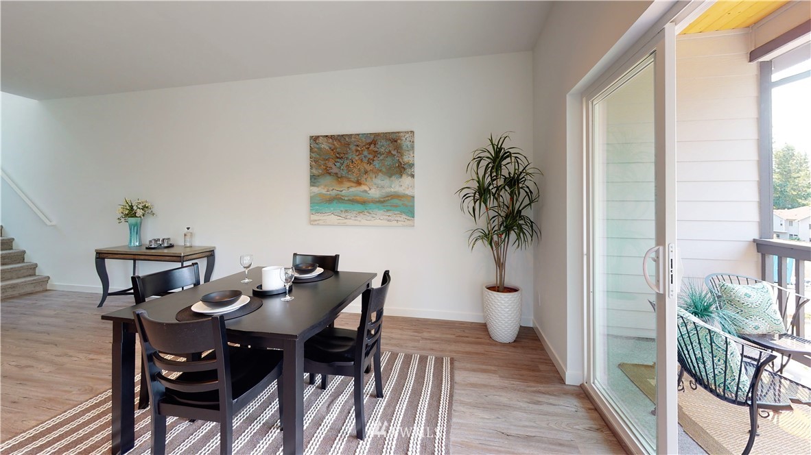 4861 Talbot Road South, Unit B3 Renton, WA 98055 - Photo 17 of 36 a view of a dining room with furniture and wooden floor