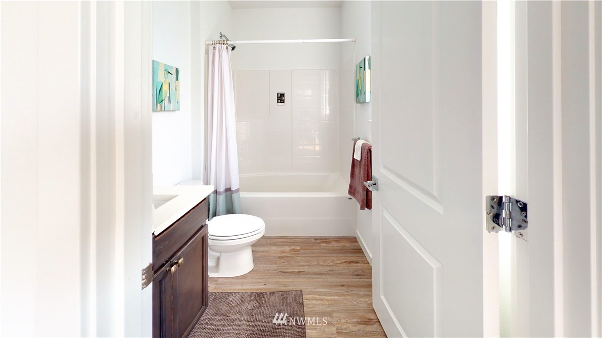 4861 Talbot Road South, Unit B3 Renton, WA 98055 - Photo 25 of 36 a bathroom with a toilet and a shower