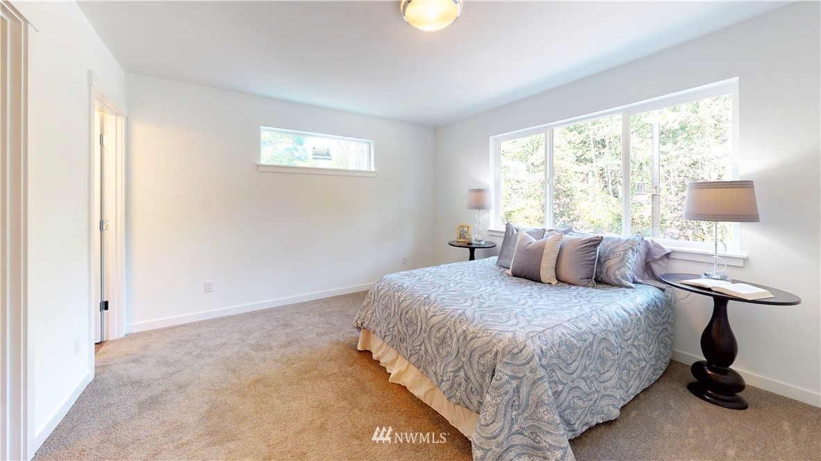 4861 Talbot Road South, Unit B3 Renton, WA 98055 - Photo 31 of 36 a bedroom with a bed and a window