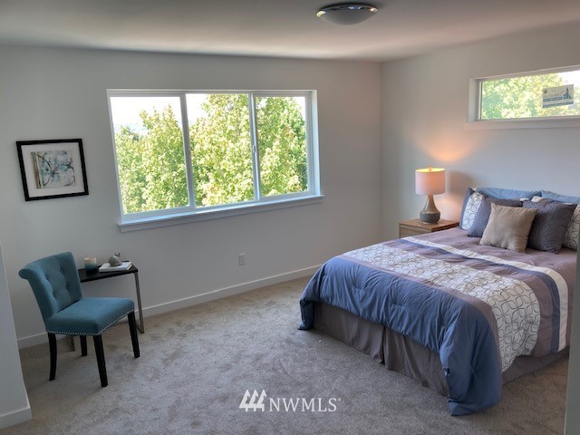4861 Talbot Road South, Unit B3 Renton, WA 98055 - Photo 35 of 36 a bedroom with a bed and a couch