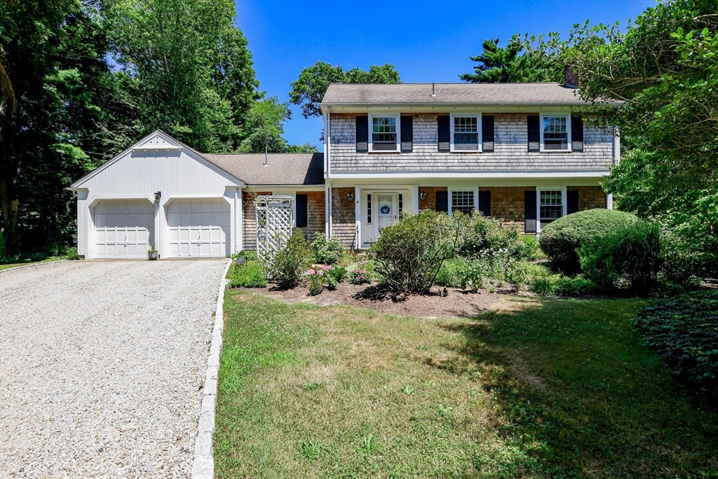 17 Olde Knoll Road Marion, MA 02738 - Photo 1 of 38 a front view of a house with yard and green space