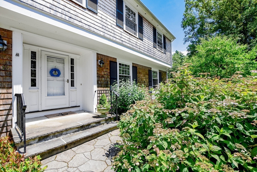 17 Olde Knoll Road Marion, MA 02738 - Photo 2 of 38 a front view of a house with a yard