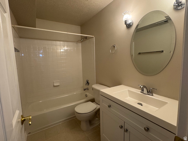 88 Canterbury Lane Logan, UT 84321 - Photo 27 of 37 Bathroom featuring a white vanity with integrated sink, chrome faucet, and an oval mirror