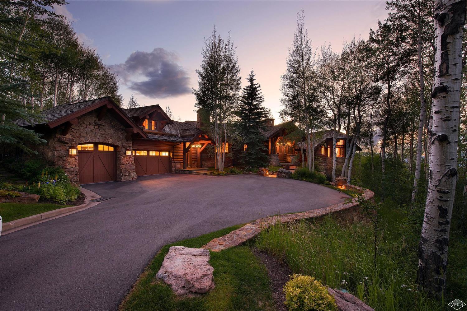 880 Daybreak Ridge Road Beaver Creek, CO 81620 - Photo 3 of 24 a front view of a house with a yard and garage