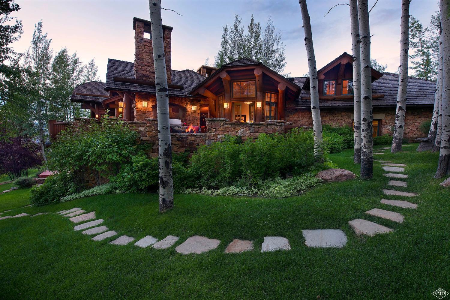 880 Daybreak Ridge Road Beaver Creek, CO 81620 - Photo 4 of 24 a front view of a house with garden