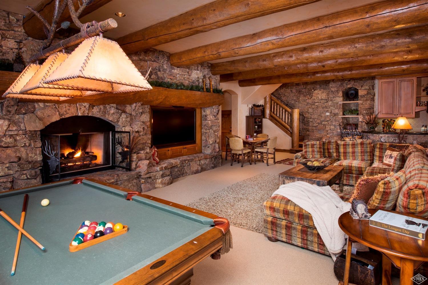 880 Daybreak Ridge Road Beaver Creek, CO 81620 - Photo 10 of 24 a room with furniture and a fireplace