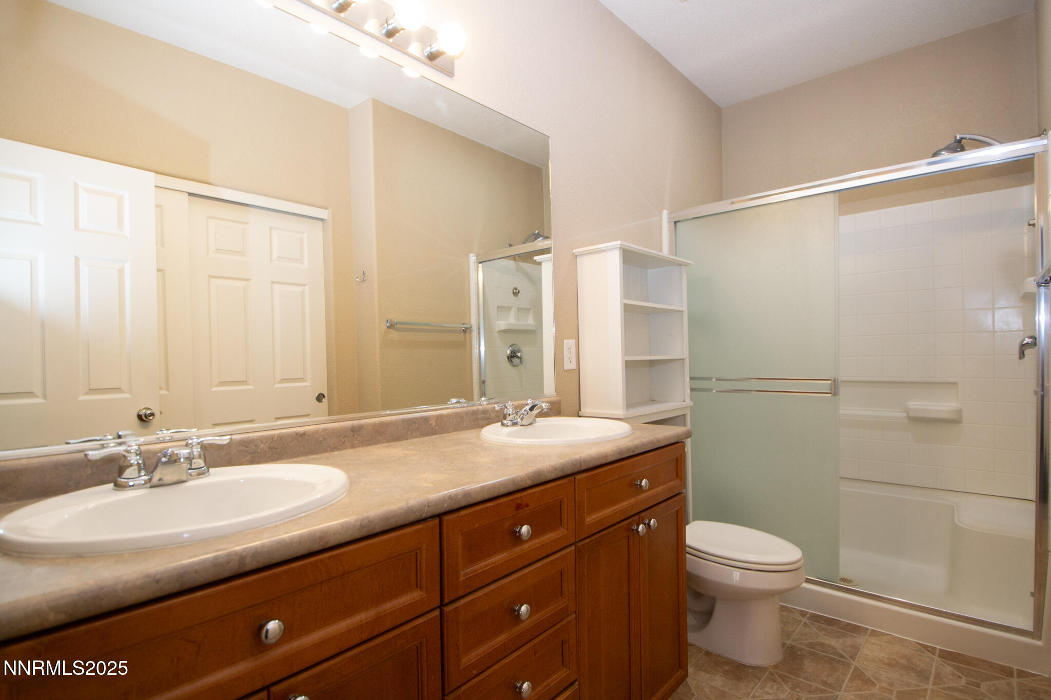 3116 Sterling Ridge Circle Sparks, NV 89431 - Photo 12 of 20 a bathroom with a granite countertop sink a toilet and shower