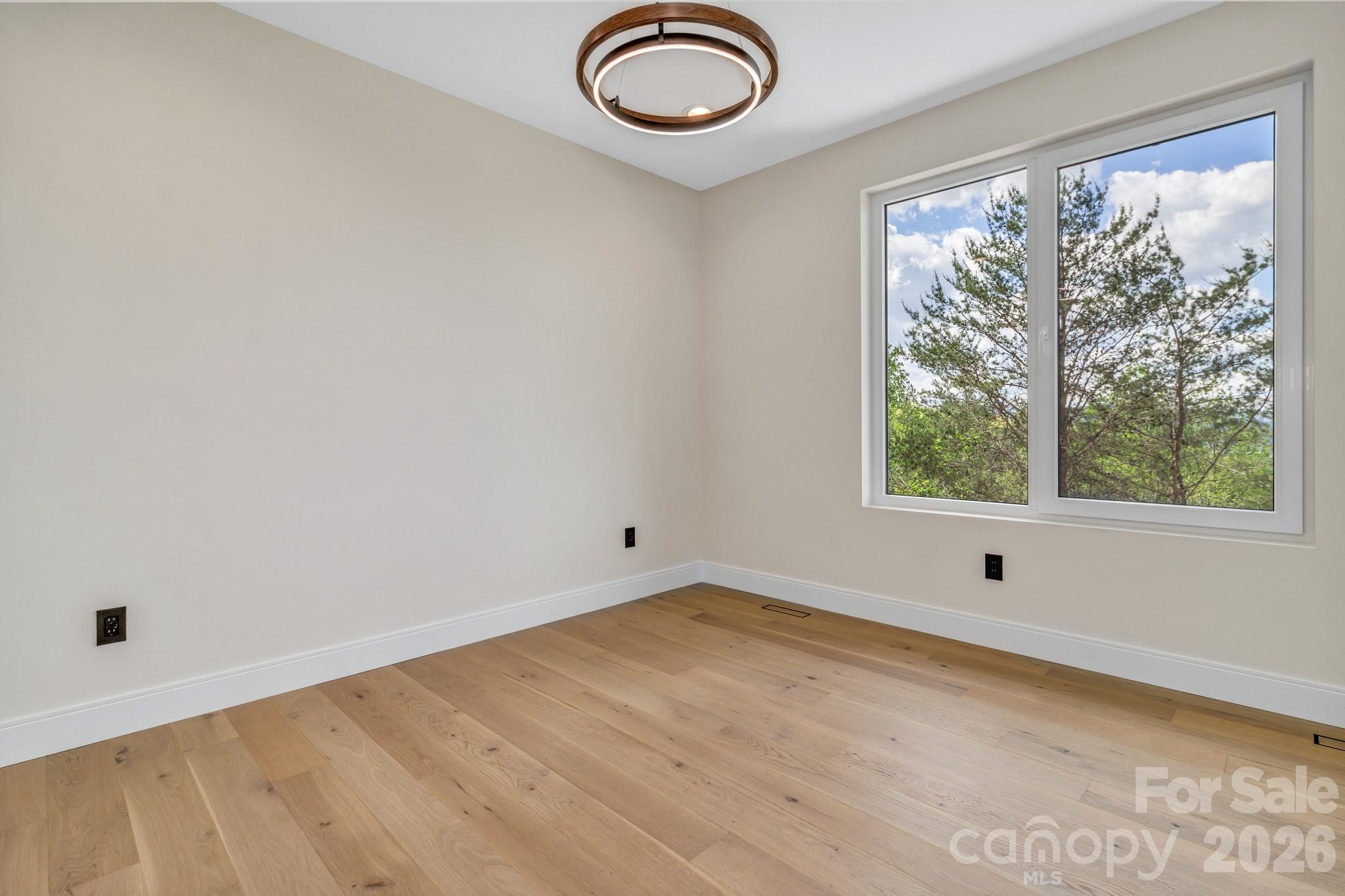 134 View Ridge Parkway Leicester, NC 28748 - Photo 33 of 48 an empty room with a window