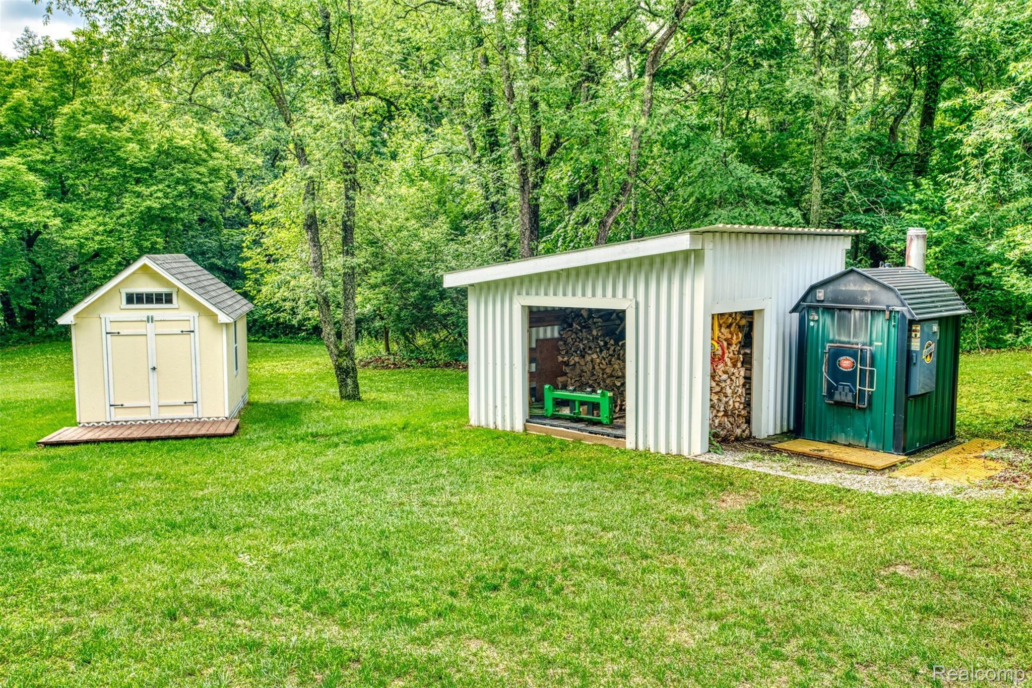 7016 West Lange Road Fowlerville, MI 48836 - Photo 47 of 61 PLAY SHED, WOOD SHED AND OUTSIDE WOOD BURNER