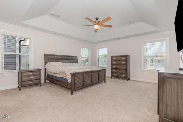 a bedroom with a bed closet and a window