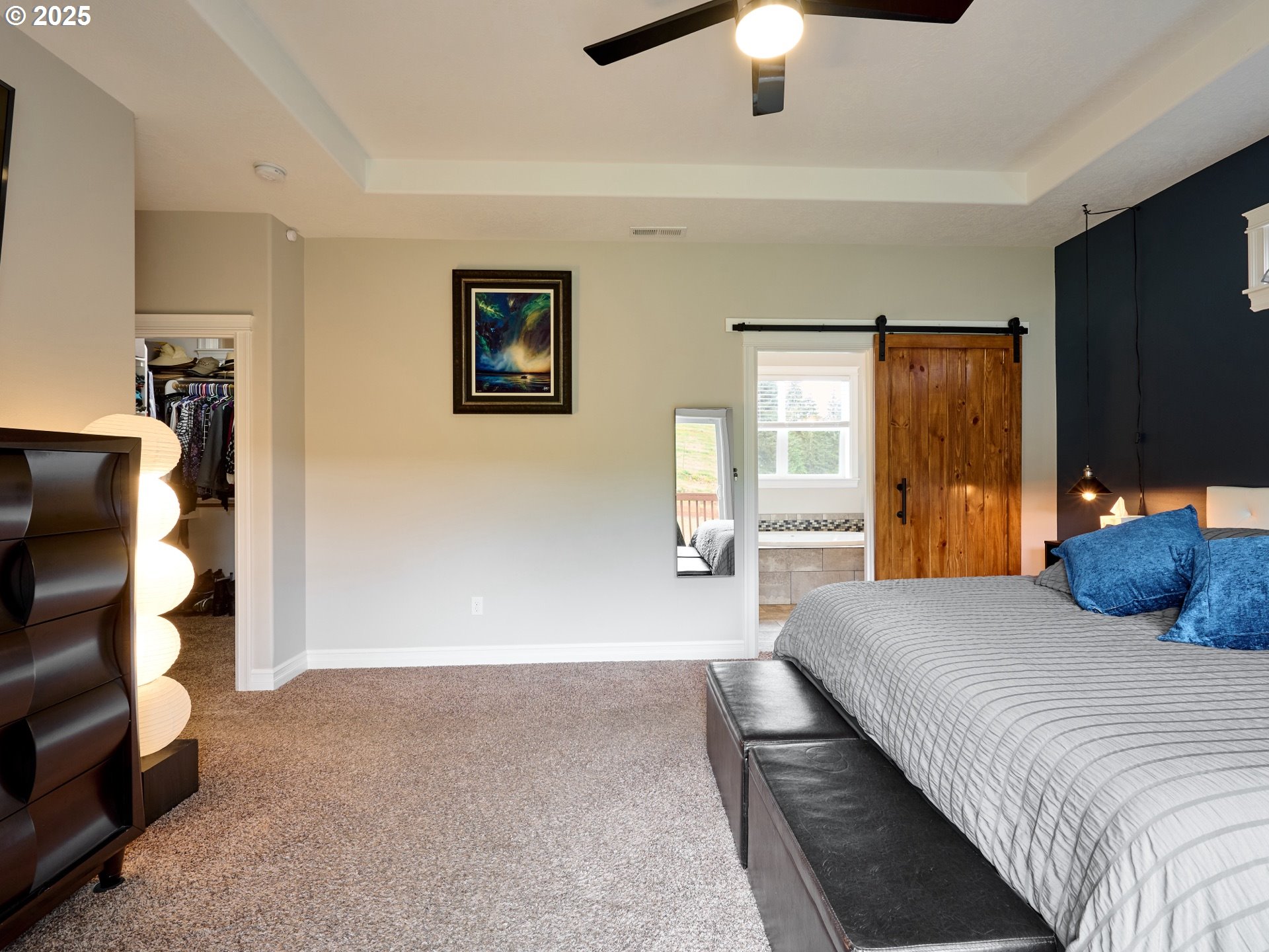 7074 Liberty Road South Salem, OR 97306 - Photo 20 of 47 a bedroom with a bed and a walk in closet