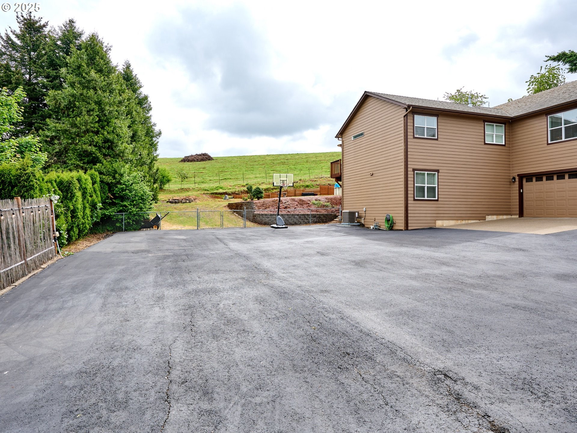 7074 Liberty Road South Salem, OR 97306 - Photo 32 of 47 a view of a house with backyard and a parking space