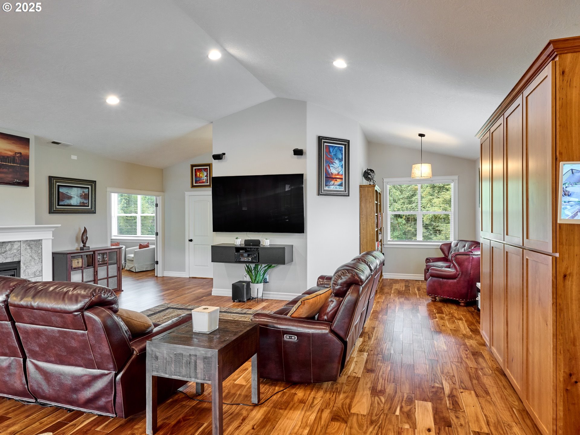 7074 Liberty Road South Salem, OR 97306 - Photo 6 of 47 a living room with furniture a flat screen tv and a large window