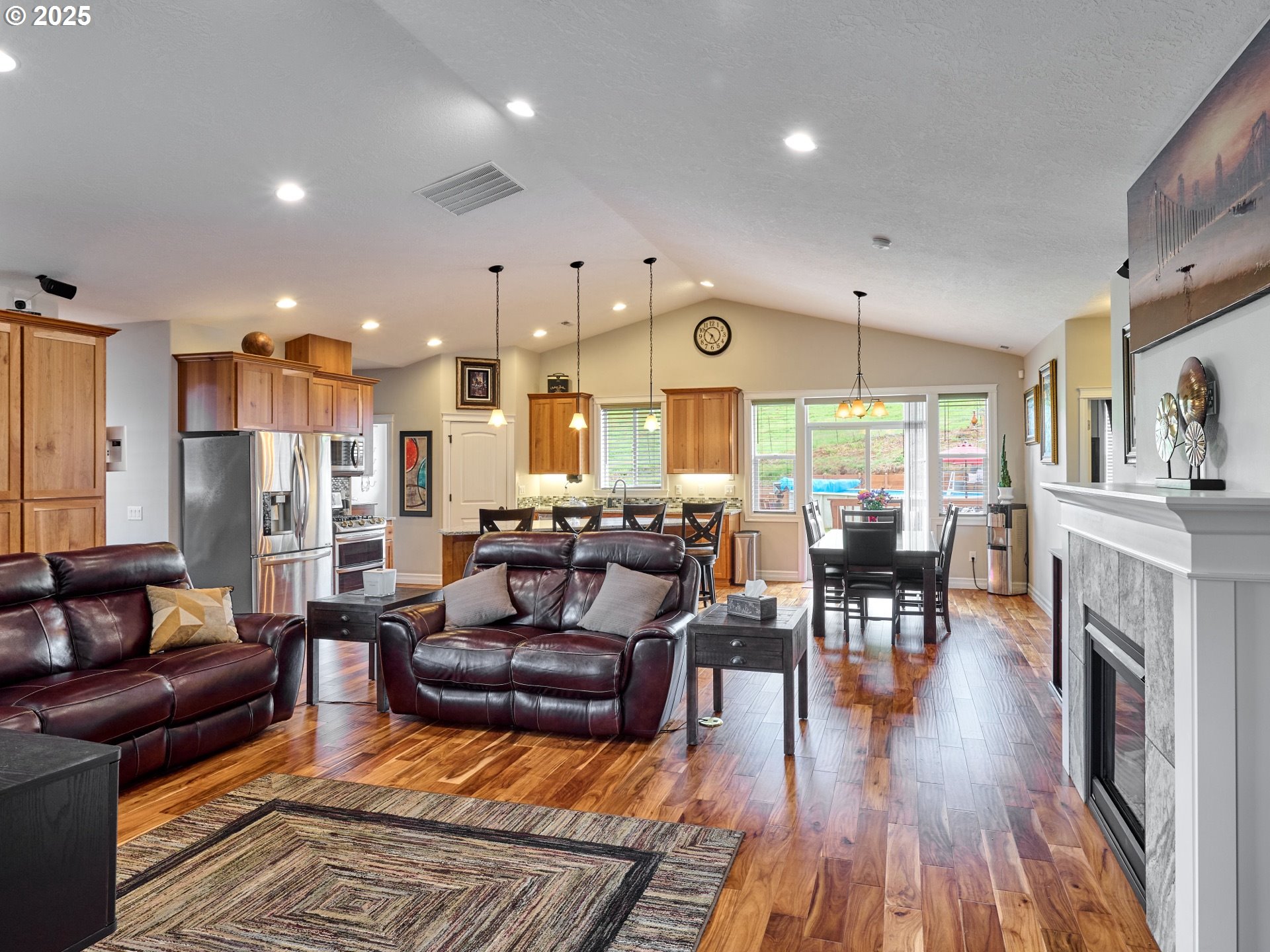 7074 Liberty Road South Salem, OR 97306 - Photo 8 of 47 a living room with fireplace furniture and a wooden floor