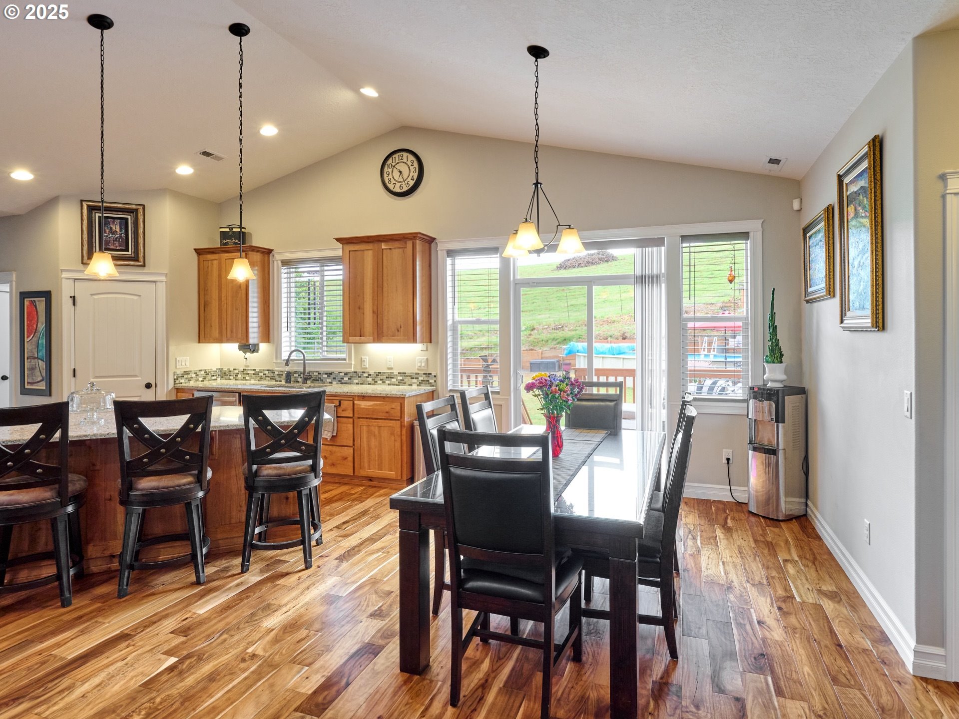 7074 Liberty Road South Salem, OR 97306 - Photo 9 of 47 a view of a dining area with furniture window and wooden floor