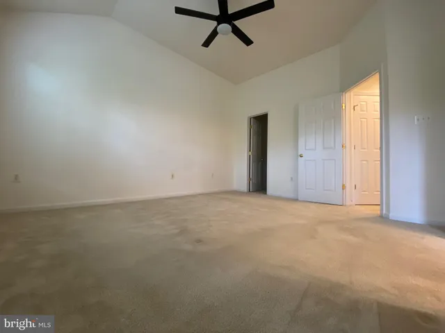 a view of an empty room and a window