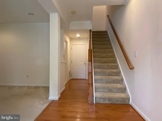 a view of a hallway with staircase