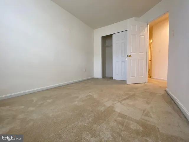 a view of an empty room and a window