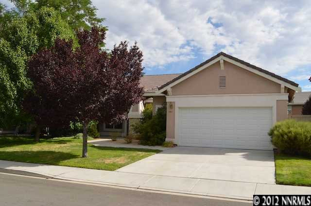 9540 Apache Rose Drive Reno, NV 89521 - Photo 1 of 1 a front view of house with garage and yard