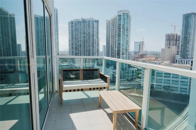 a view of balcony with two chairs and a table