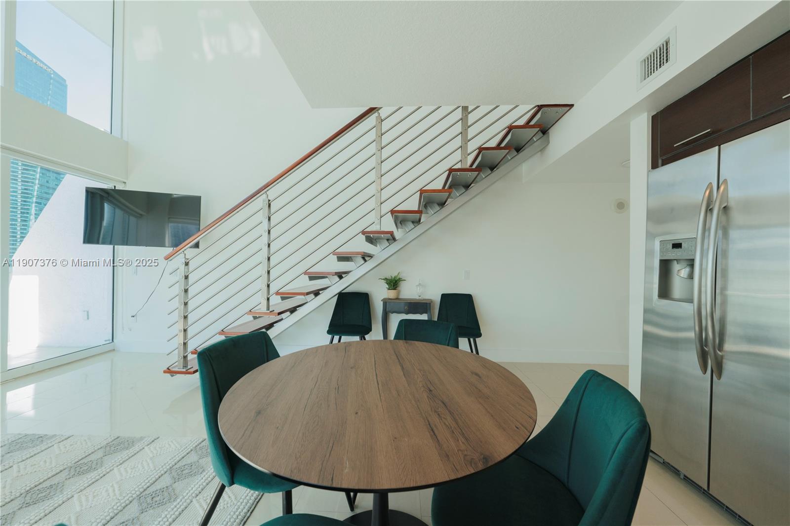 41 Southeast 5th Street, Unit 1217 Miami, FL 33131 - Photo 5 of 24 a view of entryway and hall with wooden floor