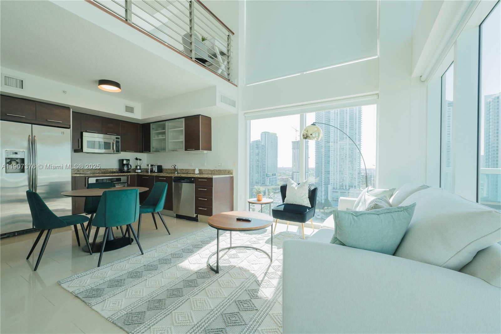 41 Southeast 5th Street, Unit 1217 Miami, FL 33131 - Photo 7 of 24 a living room with furniture and a open kitchen view