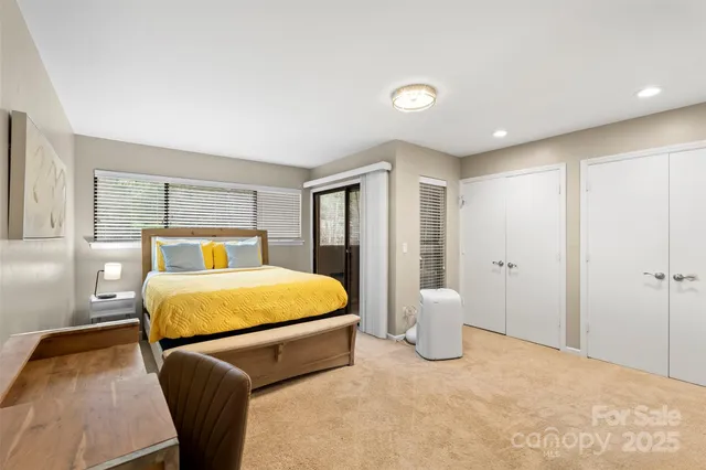 a bedroom with a bed and lamp