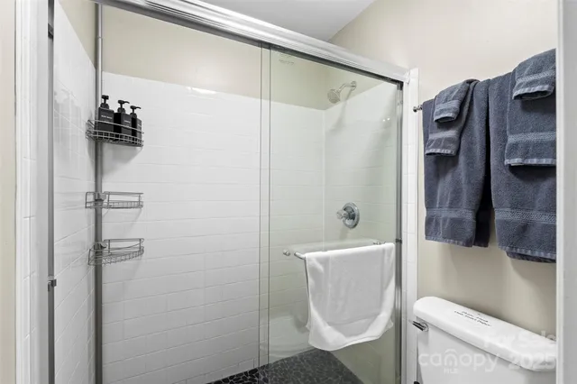 a view of porch with a chair and a floor to ceiling window