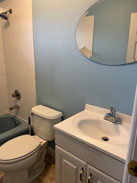 100 Silliman Street, Unit 1B Fairfield, CT 06824 - Photo 11 of 25 a white toilet sitting next to a bathroom sink