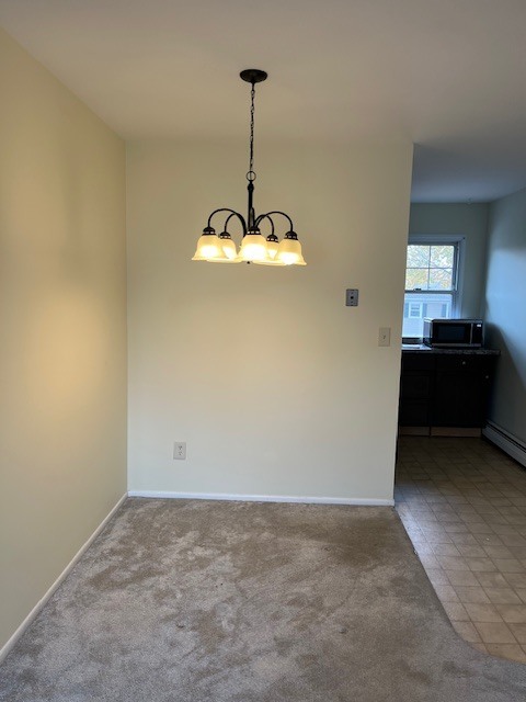 100 Silliman Street, Unit 1B Fairfield, CT 06824 - Photo 6 of 25 a view of a chandelier fan and a window in a room