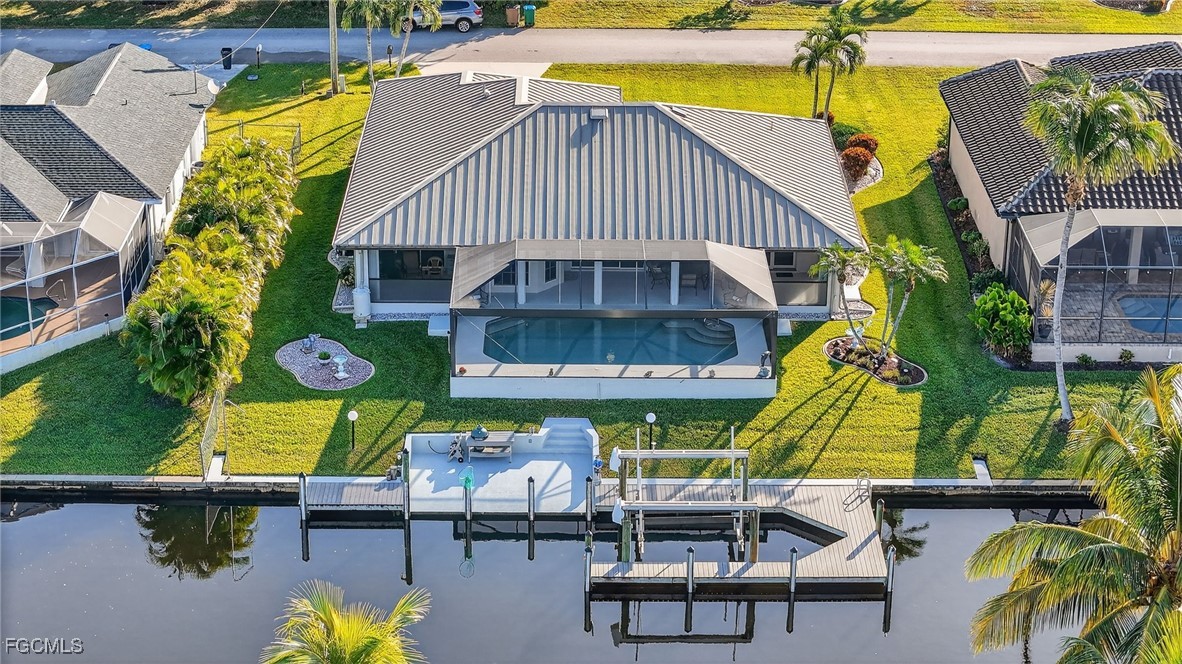 4306 Southwest 3rd Avenue Cape Coral, FL 33914 - Photo 40 of 50 an aerial view of a house with swimming pool