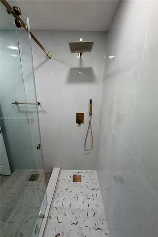 a bathroom with a sink and shower