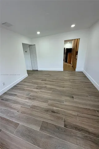 a view of a livingroom with wooden floor
