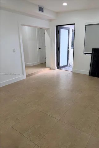 a view of a big room with closet and mirror