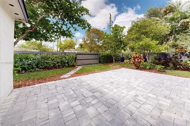 a view of a backyard of the house