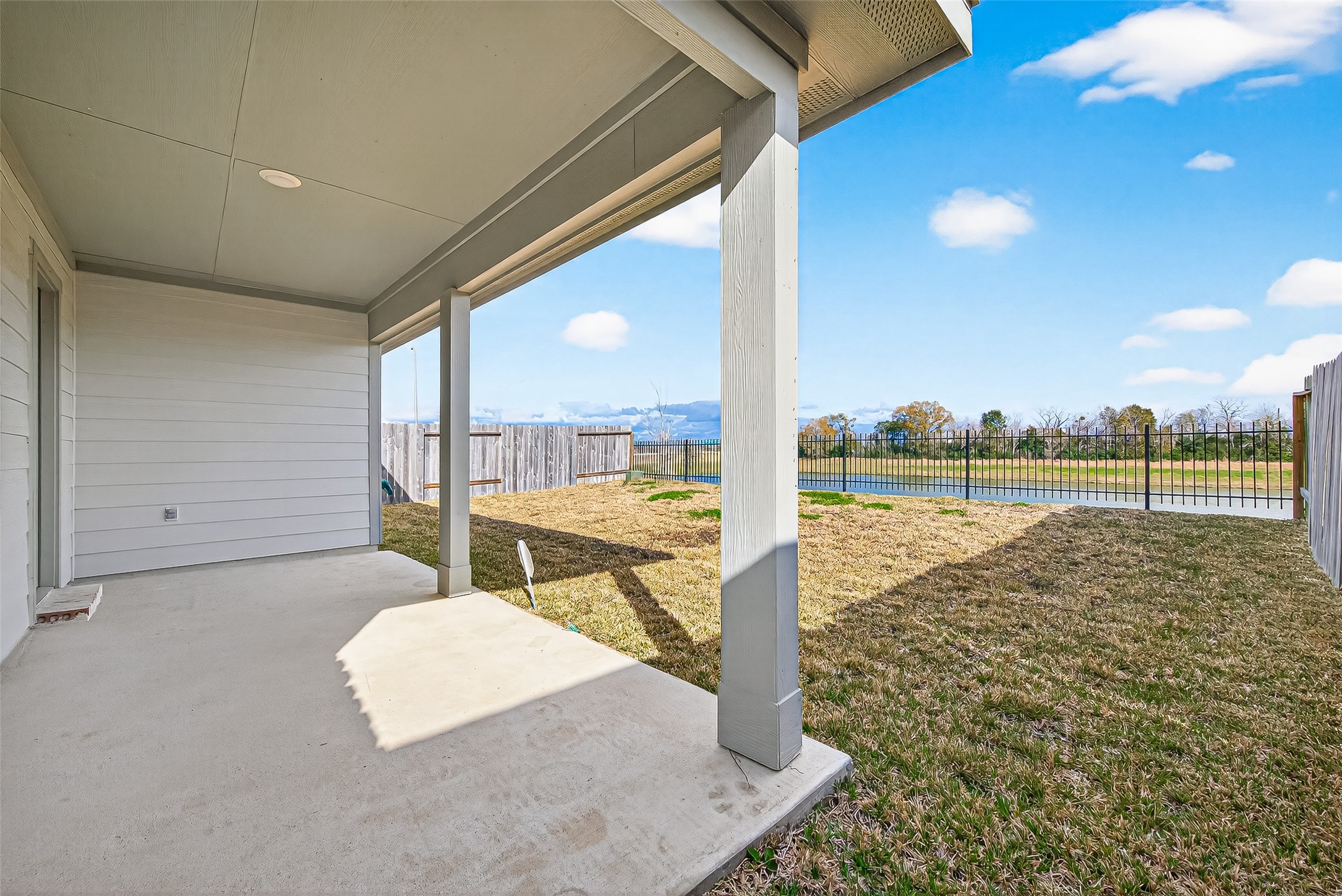 6807 Bradford Terrace Road Richmond, TX 77407 - Photo 5 of 40 Covered patio with a lake view