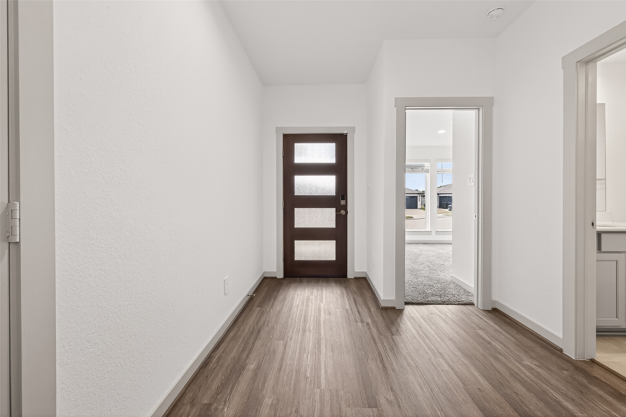 6807 Bradford Terrace Road Richmond, TX 77407 - Photo 6 of 40 an empty room with wooden floor closet and windows
