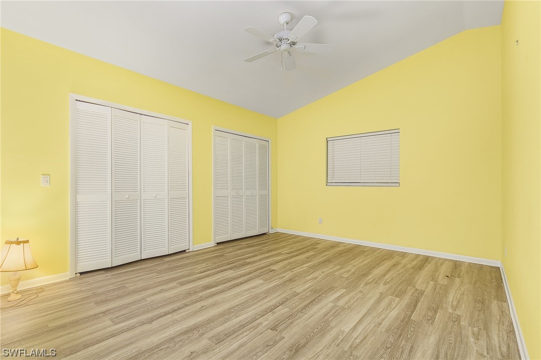 13673 Hampton Road Bokeelia, FL 33922 - Photo 19 of 28 a view of an empty room with wooden floor