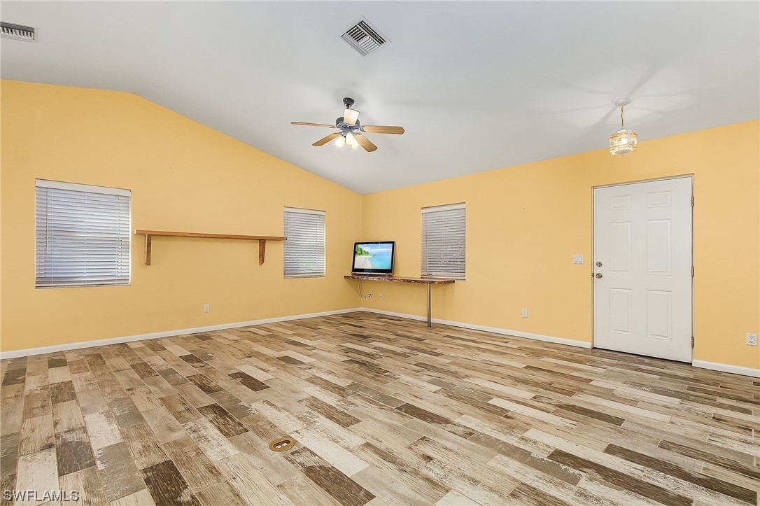 13673 Hampton Road Bokeelia, FL 33922 - Photo 21 of 28 a view of a livingroom with a ceiling fan