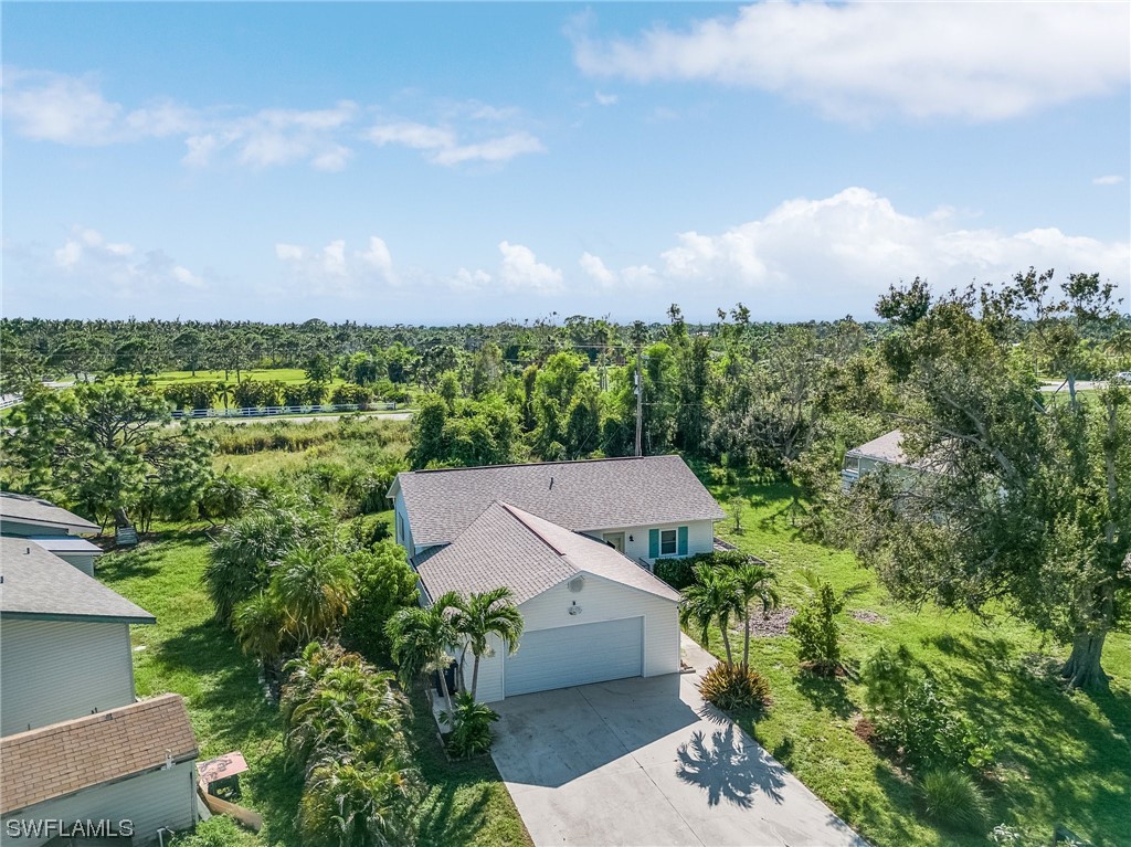 13673 Hampton Road Bokeelia, FL 33922 - Photo 24 of 28 an aerial view of a house