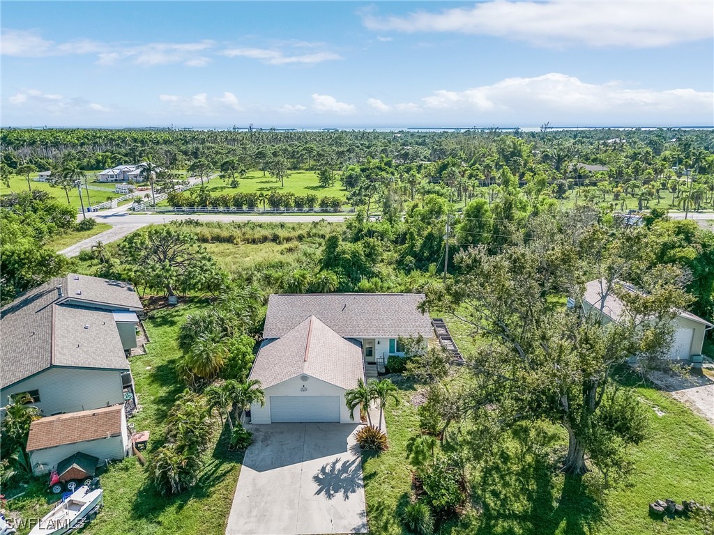 13673 Hampton Road Bokeelia, FL 33922 - Photo 25 of 28 an aerial view of a house with a yard