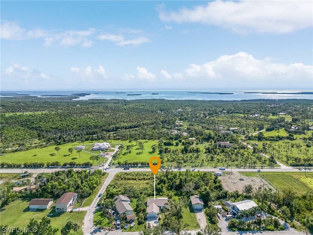 13673 Hampton Road Bokeelia, FL 33922 - Photo 26 of 28 a view of a city with lots of trees