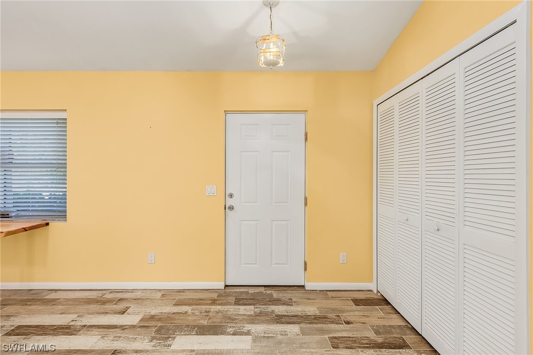 13673 Hampton Road Bokeelia, FL 33922 - Photo 6 of 28 a view of a entryway door